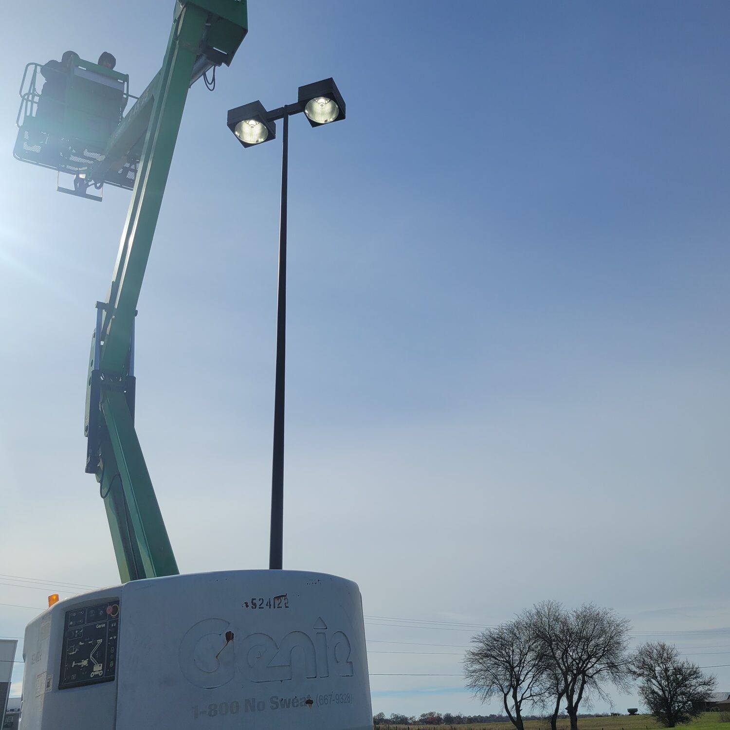 Commercial site lighting installed from a lift