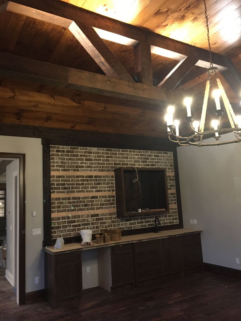 Lighting detail with stone fireplace